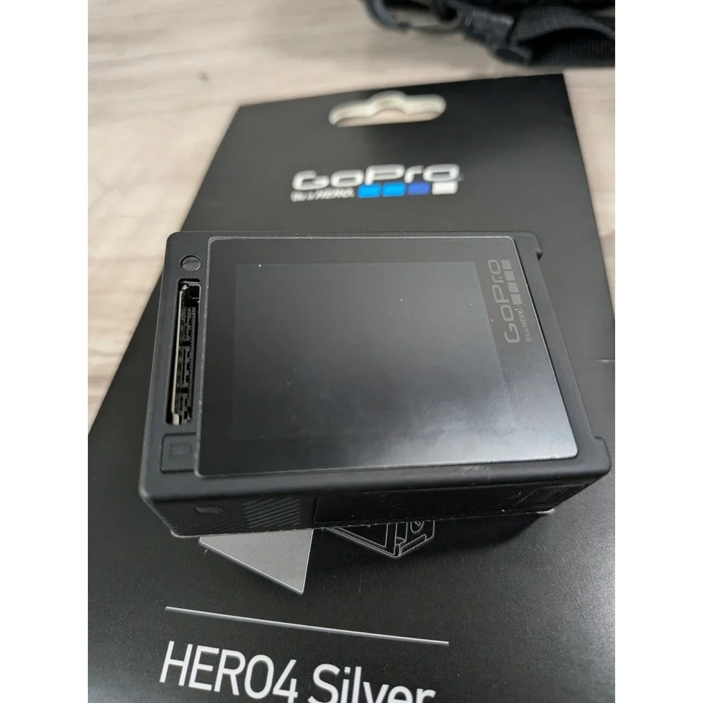 GoPro Hero 4 Silver Edition- with Accessories and Case Included